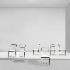 Set of six chairs by Gilbert Poillerat, circa 1947, Painted iron, gilt iron, fabric, sold May 2024