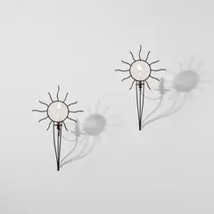 André Dubreuil, Pair of 'Soleil' wall-mounted candle holders, circa 1987, Painted steel, glass, copper
