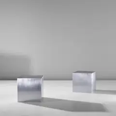 Pair of 'Cube' tables by Maria Pergay, circa 1968, Stainless steel, sold May 2024