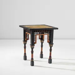 Carlo Bugatti, Games table, circa 1900, Ebonised wood, walnut, bone, vellum with inked illustrations