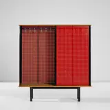 Two-sided wardrobe, designed for Cité Universitaire, Antony by Jean Prouvé and Charlotte Perriand, circa 1954, Laminate-covered hardboard, painted steel, chestnut-veneered wood, maple-veneered wood, aluminium, sold Nov 2024
