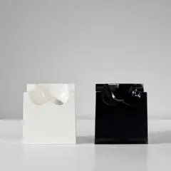 Roy Adzak, Two 'Fesse' chairs, designed circa 1970, produced 1992, Gel-coated moulded fibreglass