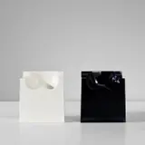 Roy Adzak, Two 'Fesse' chairs, designed circa 1970, produced 1992, Gel-coated moulded fibreglass