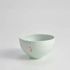 Bowl by Edmund de Waal, 1995, porcelain with celadon and red glaze, sold Apr 2024