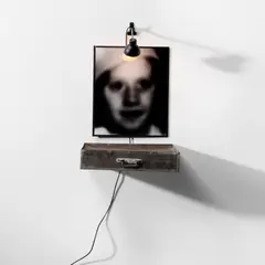 Tiroir by Christian Boltanksi, 1988, gelatin silver print, clothes, metal tin drawer, wire mesh and electric lamp, sold Jul 2023