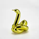 Jeff Koons, Balloon Swan (Yellow), 2017, Porcelain multiple painted in chrome, contained in the original Styrofoam-lined box with silver printed signature