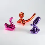 Jeff Koons, Balloon Swan (Magenta); Balloon Monkey (Orange); and Balloon Rabbit (Violet), 2017, Three porcelain multiples painted in chrome, all contained in the original Styrofoam-lined boxes with silver printed signature