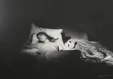 Alain Nogues, Untitled, A gelatin silver print photograph of Jane Birkin in the nude lying on a bed 1969