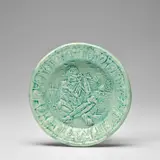 Joueur de flûte (Flute player) (see A.R. 126-128) by Pablo Picasso, 1951, White earthenware round plate painted in green and glazed, offered Dec 2023