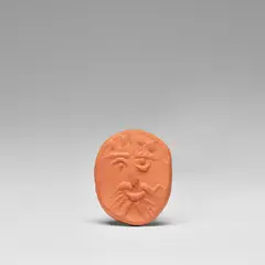 Visage (Face) (A.R. 243) by Pablo Picasso, 1954, Red earthenware medallion, contained in the original velvet-covered case, sold Dec 2023