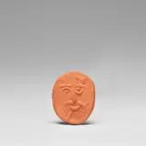 Visage (Face) (A.R. 243) by Pablo Picasso, 1954, Red earthenware medallion, contained in the original velvet-covered case, sold Dec 2023