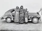 Seydou Keïta, Untitled (Two women and a girl with Peugeot automobile)