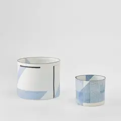 Two cylinders, from the 'Architectural Volume' series by Bodil Manz, circa 2006, Cast porcelain with high-fired transfers, sold Jan 2023