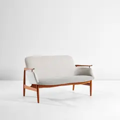 Finn Juhl, Two-seater sofa, circa 1953, Teak, fabric, brass