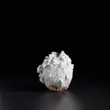 Akiko Hirai, Moon jar, circa 2021, Grogged stoneware, rugged and cracked porcelain deposits over layered slips beneath running ash glazes