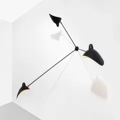 Three-armed wall light by Serge Mouille, circa 1955, Painted steel, painted aluminium, brass, sold Apr 2023