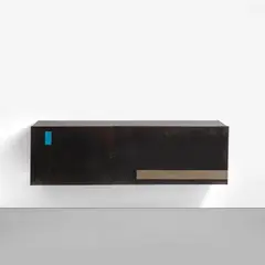 Unique wall-mounted sideboard by Gilbert Poillerat, circa 1960, Patinated brass, nickel-plated metal, lacquered metal, brass, offered Apr 2023