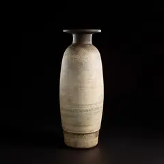 Hans Coper, Monumental bottle with disc top, circa 1959, Stoneware, layered porcelain slips and engobes over a textured body, the neck, lip and interior with a manganese glaze
