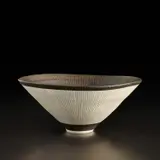 Conical bowl by Lucie Rie, circa 1974, Porcelain with manganese glaze, radiating inlaid and sgraffito design, sold Apr 2023