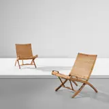 Hans J. Wegner, Two folding chairs, model no. 512, circa 1949, Oak, cane, brass