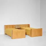 Jean Royere, Pair of 'Herbier' beds with integrated headboard and bedside tables, circa 1956, Birch, birch-veneered wood, oak-veneered wood, glass, dried leaves and flowers, brass