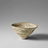 Oval bowl by Lucie Rie, circa 1980, Stoneware, heavy volcanic white and yellow flowing glazes, sold Nov 2023