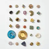 Lucie Rie, 29 buttons and brooches