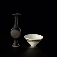 Small conical bowl by Lucie Rie, 1951, Porcelain, clear glaze, manganese band with diagonal sgraffito, sold Nov 2023