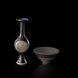 Early vase with flattened body by Lucie Rie, circa 1957, Porcelain, manganese and blue glazes with sgraffito, sold Nov 2023