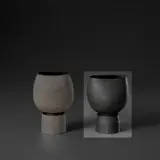 Cup on stand with internal stem holder by Hans Coper, circa 1969, Stoneware, pitted black glaze over a textured and incised body, sold Nov 2023