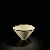 Conical 'Rice' bowl by Lucie Rie, 1958, Porcelain, shiny white glaze with manganese lip, the glaze flowing into pierced holes in the body, sold Nov 2023
