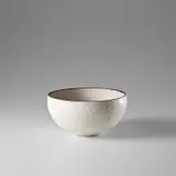 Large rounded bowl by Lucie Rie, circa 1969, Stoneware, matt white pitted glaze, manganese rim, sold Nov 2023