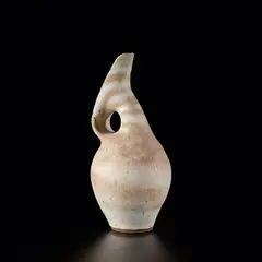 Pitcher by Lucie Rie, circa 1984, Mixed clays producing an integral spiral beneath the glaze, sold Nov 2023