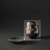 Lucie Rie, Early vase, circa 1959, Stoneware, flowing manganese glaze and sgraffito creating a chequered basketweave pattern