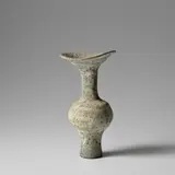 Vase with flaring lip by Lucie Rie, circa 1980, Stoneware, mixed clays forming an integral spiral beneath the glaze, sold Nov 2023