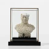 Bouke de Vries, Skull Mao, 2009, porcelain on a granite plinth in a glass and gilt metal box frame