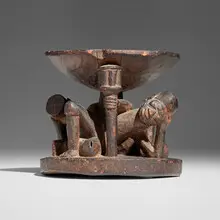 Agere ifa bowl with kneeling figures by Yoruba, carved wood, sold Jul 2025