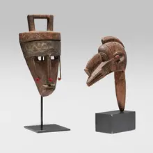 Mask and puppet head by African, carved wood, steel, string, sold Jul 2025