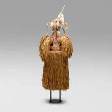 Asmat, Jipae Baju Setan (Ghost Armor) ceremonial body mask, sago palm leaves, rattan, Fum rope, carved and painted wood, feathers, beads, seeds, vegetable fiber