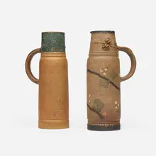Pitchers with vines and hawthorn branches, set of two by Ernest Chaplet, c. 1885, hand-carved, glazed and gilt stoneware, sold Feb 2026