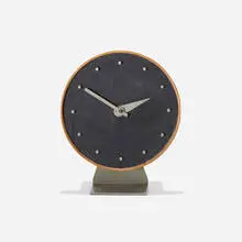 Masonite table clock, model 4767A by George Nelson & Associates, 1949, lacquered wood, Masonite, walnut, enameled steel, enameled aluminum, sold May 2025