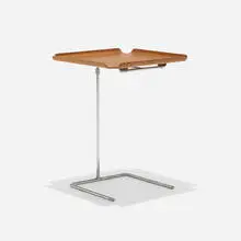 Tray table, model 4950 by George Nelson & Associates, 1949, molded walnut plywood, chrome-plated steel, sold May 2025