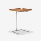 Tray table, model 4950 by George Nelson & Associates, 1949, molded walnut plywood, chrome-plated steel, sold May 2025