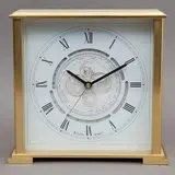 Reloj Para Mesa, SIGLO XX, Bronce dorado, vidrio y acrílico; carátula con números romanos, horario mundial; se incluye instructivo