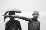 Mário Macilau, Two Boys with a Fish from Faith, 2018, Archival pigment print, mounted