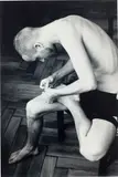 Anders pulling splinter from his foot (b/w) by Wolfgang Tillmans, 2004, Chromogenic print, sold Nov 2022