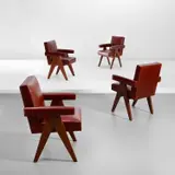 Set of four 'Committee' armchairs, designed for the High Court, the Assembly and Punjab University administrative buildings, Chandigarh by Pierre Jeanneret, circa 1959, Leather, teak, offered May 2022