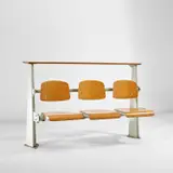 Amphitheatre seating by Jean Prouvé, circa 1950, Painted steel, oak, beech-veneered plywood, aluminium, sold May 2022