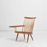 'Lounge Chair with Arm Right' by George Nakashima, designed circa 1962, executed 1963, American black walnut, hickory, sold May 2022