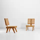 Pair of chairs by Pierre Jeanneret, circa 1956, Oak, rattan, sold May 2022